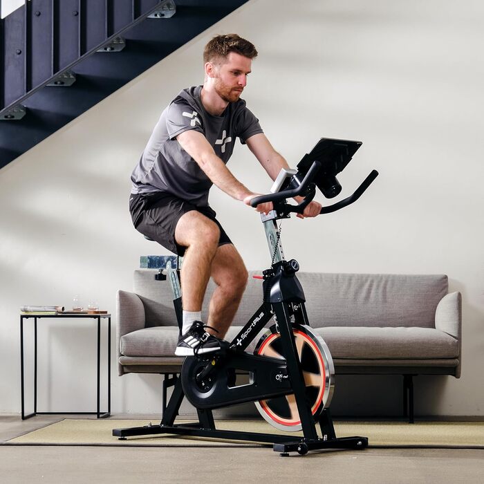 Спортивний велосипед SportPlus Speedbike з тримачем для планшета, сумісний з додатком Speedracer, маховик ~13 кг, плавне регулювання опору, тримач для напоїв, LCD дисплей для тренувань чорного кольору