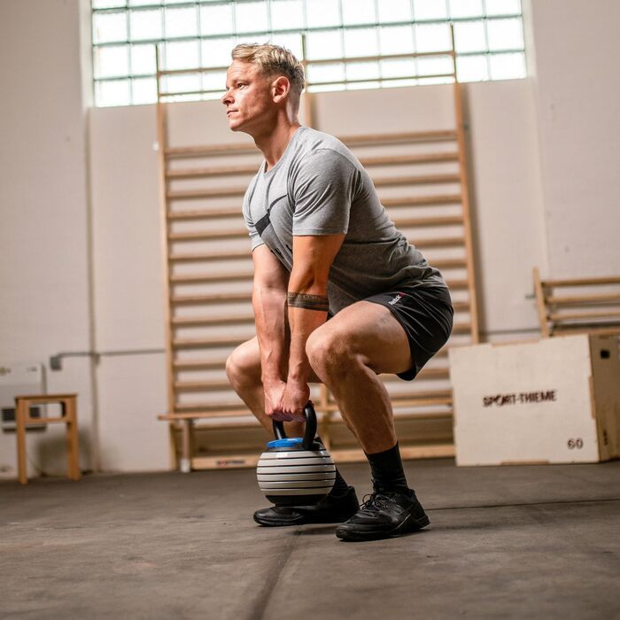 Набір гантелей-гир Кетелбел Sport-Thieme Vario | Регульовані гантелі з змінними дисками: 4-18 кг | Компактні, безпечні | Сталь, пластик | Чорно-сіро-блакитні | Якість бренду