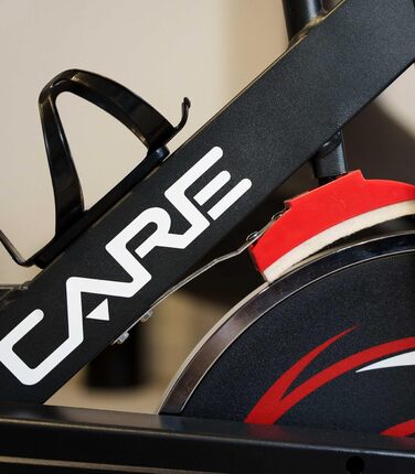 CARE FITNESS Велотренажер для дому - Spike 74450 з маховиком 12 кг, педалі з зачепом, триатлонний кермо та ролики для пересування