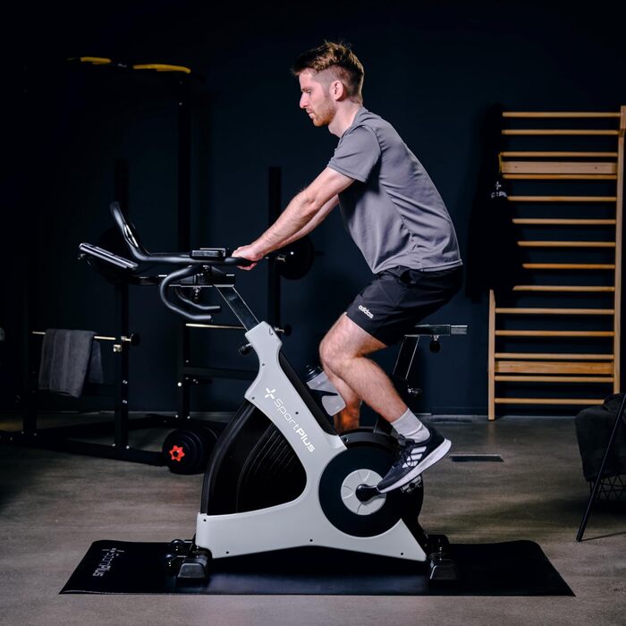 Велотренажер SportPlus Speedbike з тримачем для планшета, сумісний з додатком Speedracer, безступеневе регулювання навантаження, тримач для пляшки, LCD-дисплей тренувань